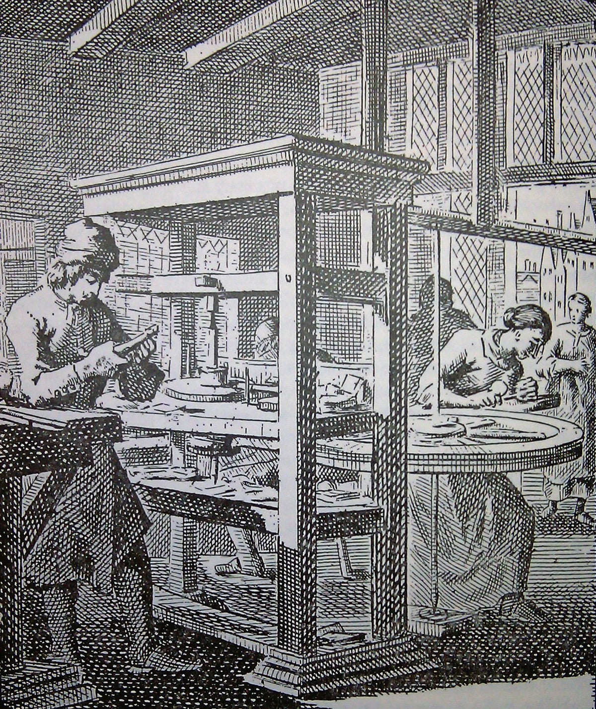 A black and white picture of a medievial machine for gem cutting.