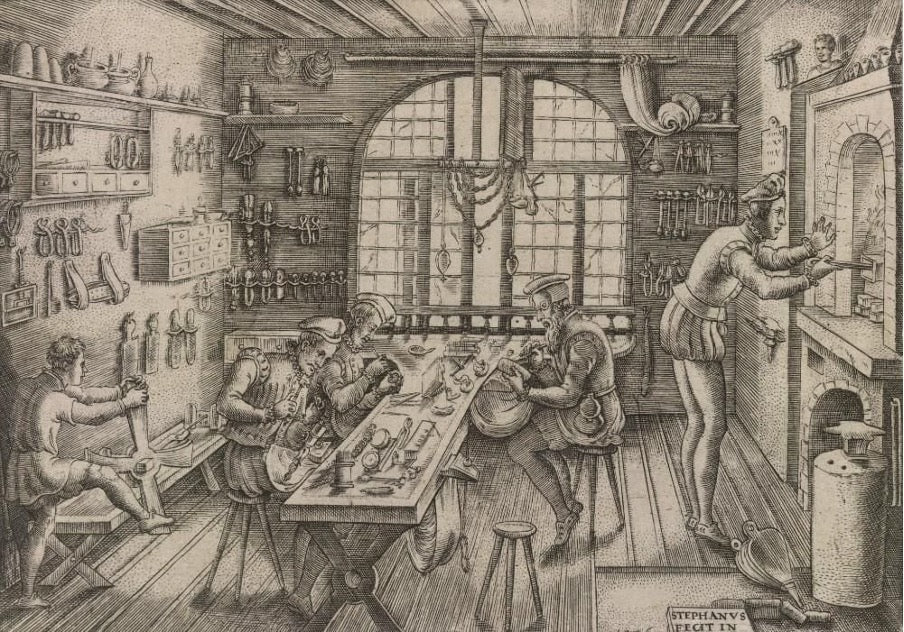 A lively drawing of a workshop filled with individuals focused on various tasks.