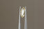 A natural geometric marquise portrait cut yellow sapphire available to add as a center stone for your heirloom setting at The North Way Studio. A warm, pale yellow with hints of sunshine. The sapphire is shown held up by tweezers.