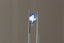 A periwinkle blue shield cut sapphire with light blue zoning