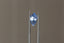 A periwinkle blue shield cut sapphire with light blue zoning