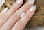 An ethereal white marquise sapphire with hints of pale blue and peach opalescence