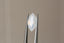 An ethereal white marquise sapphire with hints of pale blue and peach opalescence