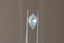 An opalescent light blue and pale yellow shield cut sapphire