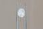 A natural oval opalescent pale blue sapphire available to add as a center stone for your heirloom ring setting at The North Way Studio. Silken pale blue, so faint it's nearly white, churns with peaches and sunlit hues. The sapphire is shown facing the viewer and held with tweezer.