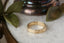 Engraved 5mm wedding band with leaf design.