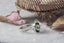 Side view of the Meadowsweet engagement ring by The North Way Studio and Claire Pettibone. Hand carved leaf and bark band with dark green oval sapphire and natural diamonds.