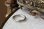 Satin finish antique-inspired 4mm wide wedding band.