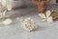 Natural diamond marquise leaves and a graduated diamond halo are set in reclaimed 18 karat yellow gold around an antique old European cut diamond. Ready to ship antique inspired flower engagement ring, size 6.