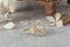 Natural diamond marquise leaves and a graduated diamond halo are set in reclaimed 18 karat yellow gold around an antique old European cut diamond. Ready to ship antique inspired flower engagement ring, size 6.