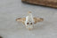 This custom heirloom engagement ring setting designed and crafted by The North Way Studio features delicate leaves carved in reclaimed gold and a cluster of diamond dew drops spun about your choice of center gemstone. This fantasy ring is shown in 14 karat yellow gold with a large pear cut diamond center.