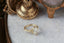 A timeless fairytale alternative engagement ring crafted by The North Way Studio. This fantasy inspired solitaire ring features hand-carved leaf details, claw prongs, and a custom center stone. The customizable ring is shown in reclaimed yellow gold and lab grown oval diamond.