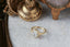 A timeless fairytale alternative engagement ring crafted by The North Way Studio. This fantasy inspired solitaire ring features hand-carved leaf details, claw prongs, and a custom center stone. The customizable ring is shown in reclaimed yellow gold and lab grown oval diamond.