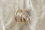 Everyday yellow gold hoop earrings with hand-carved leaves.