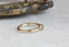 A solitaire ring inspired by antique collet settings in 14 karat yellow gold and natural Montana sapphire