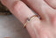 A solitaire ring inspired by antique collet settings in 14 karat yellow gold and natural Montana sapphire