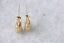 Flower hoop earrings hand-carved in reclaimed 10 karat yellow gold.