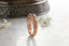 A hand-carved rose gold medieval floral signet band inspired by Joan of Arc