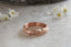 A rose gold medieval floral signet band inspired by Joan of Arc