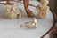 A ready to ship diamond halo fantasy engagement ring in 14 karat yellow gold and lab grown oval diamond
