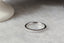A straight wedding band with half eternity natural diamonds