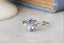 Natural pear cut blue sapphire and diamond marquise leaf engagement ring.