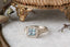 Fantasy elven alternative engagement ring designed and crafted by The North Way Studio. This ready to ship fairytale engagement ring features a diamond halo, a blue princess cut sapphire center, and hand-carved leaves and vines in reclaimed 18 karat white gold.