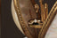 A diadem of dawn is perched atop a gold band and antique glass egg.