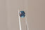 A magical multi-colored oval natural sapphire with teal edges and blue and red center. 