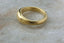 An 18 karat yellow gold signet ring meant to resemble ancient jewelry 
