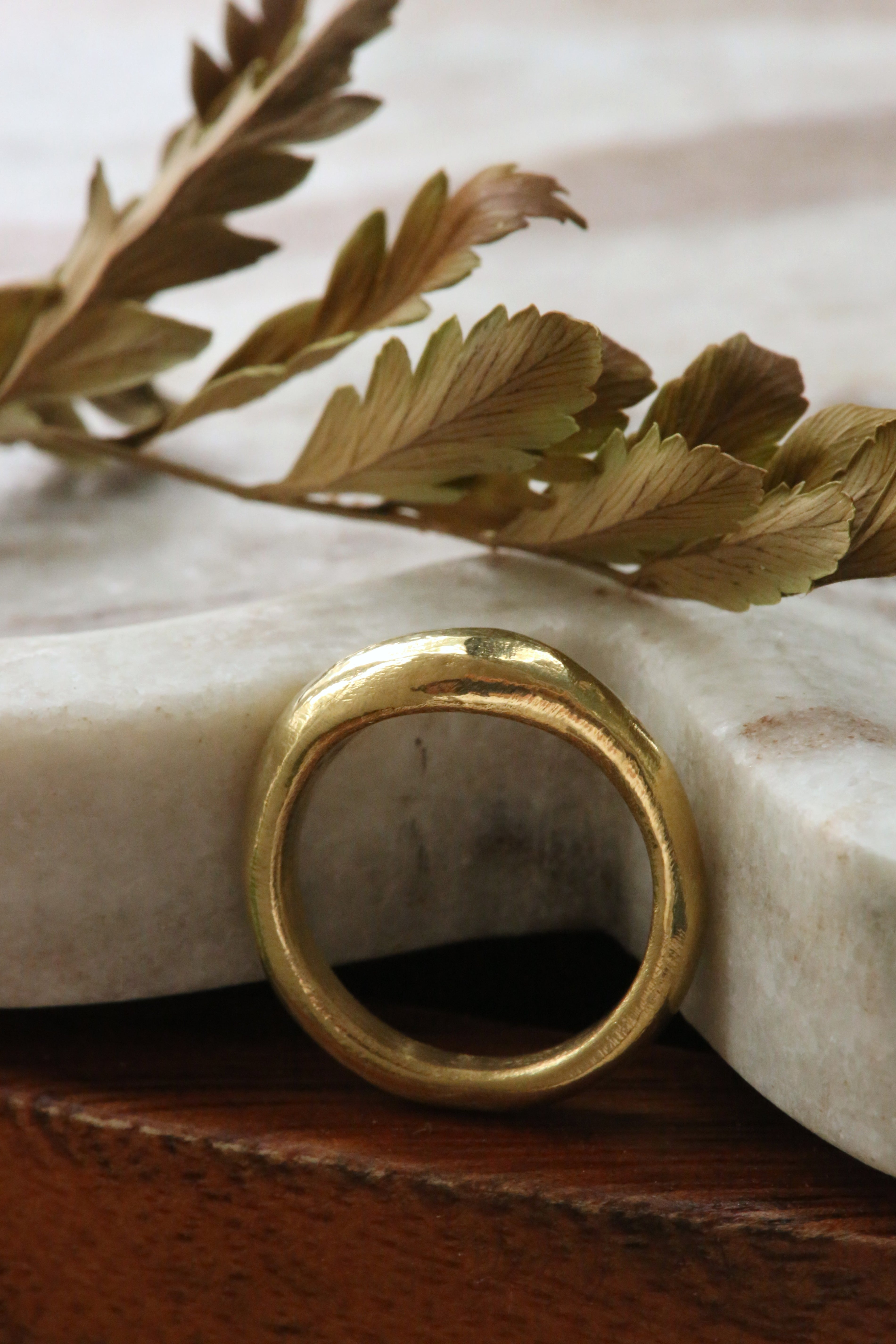 Rounded profile with low-dome signet ring in choice of gold. 