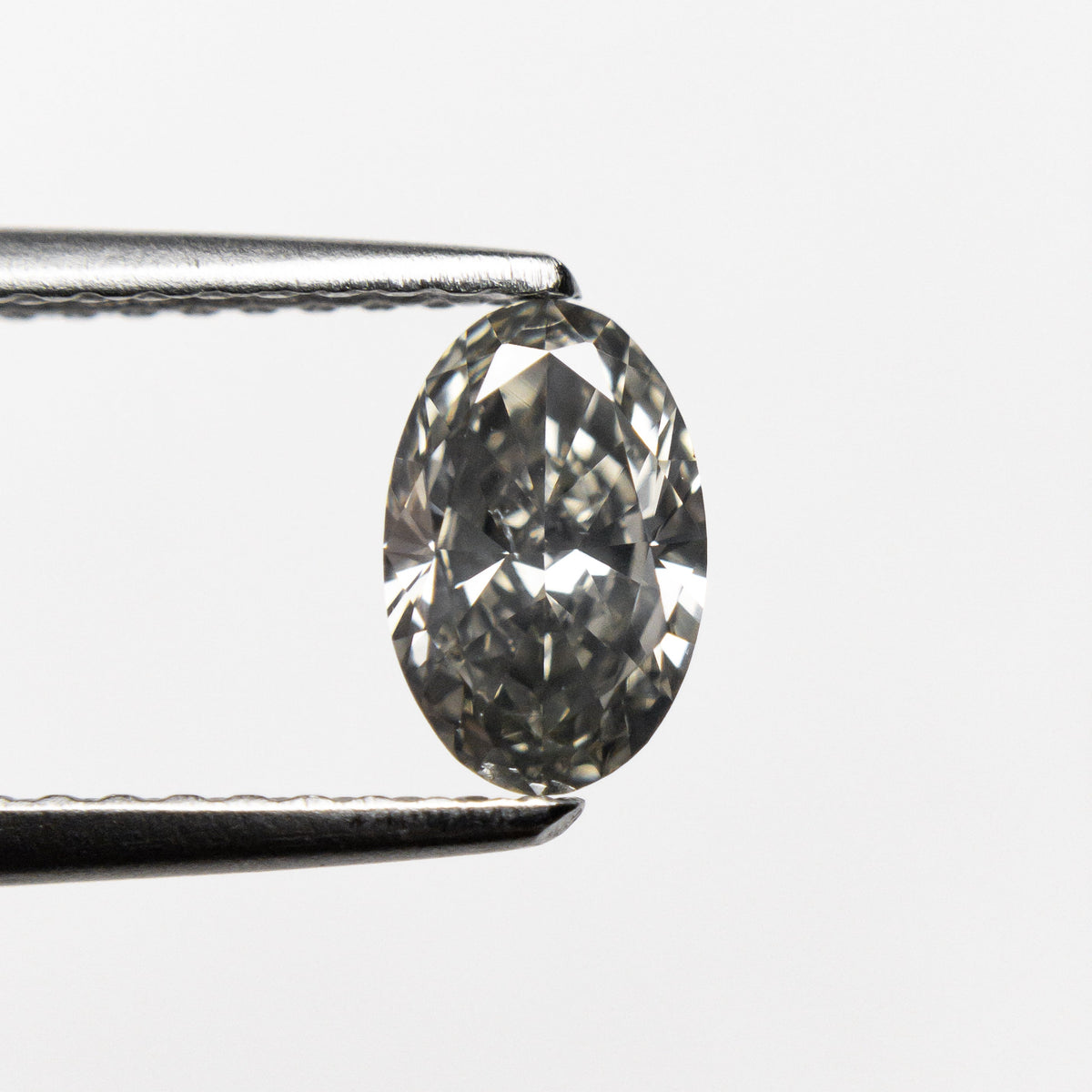 0.62ct 6.86x4.42x2.79mm SI1 Fancy Grey Oval Brilliant 19923-19