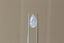 A large pear cut sapphire in milky, silky pale dusky blue with hints of peach opalescence