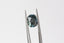 A natural multi-colored cushion cut sapphire with gorgeous hues of teal, green, faint ochre, and a hint of burgundy brown. This 4.12 carat color changing sapphire is available to add to a custom heirloom setting at The North Way Studio.