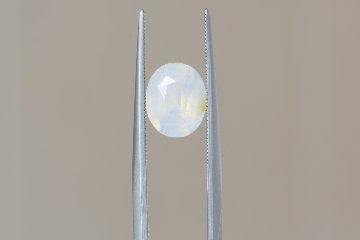 2.56 Carat Natural Opalescent Pale Blue White Oval Sapphire