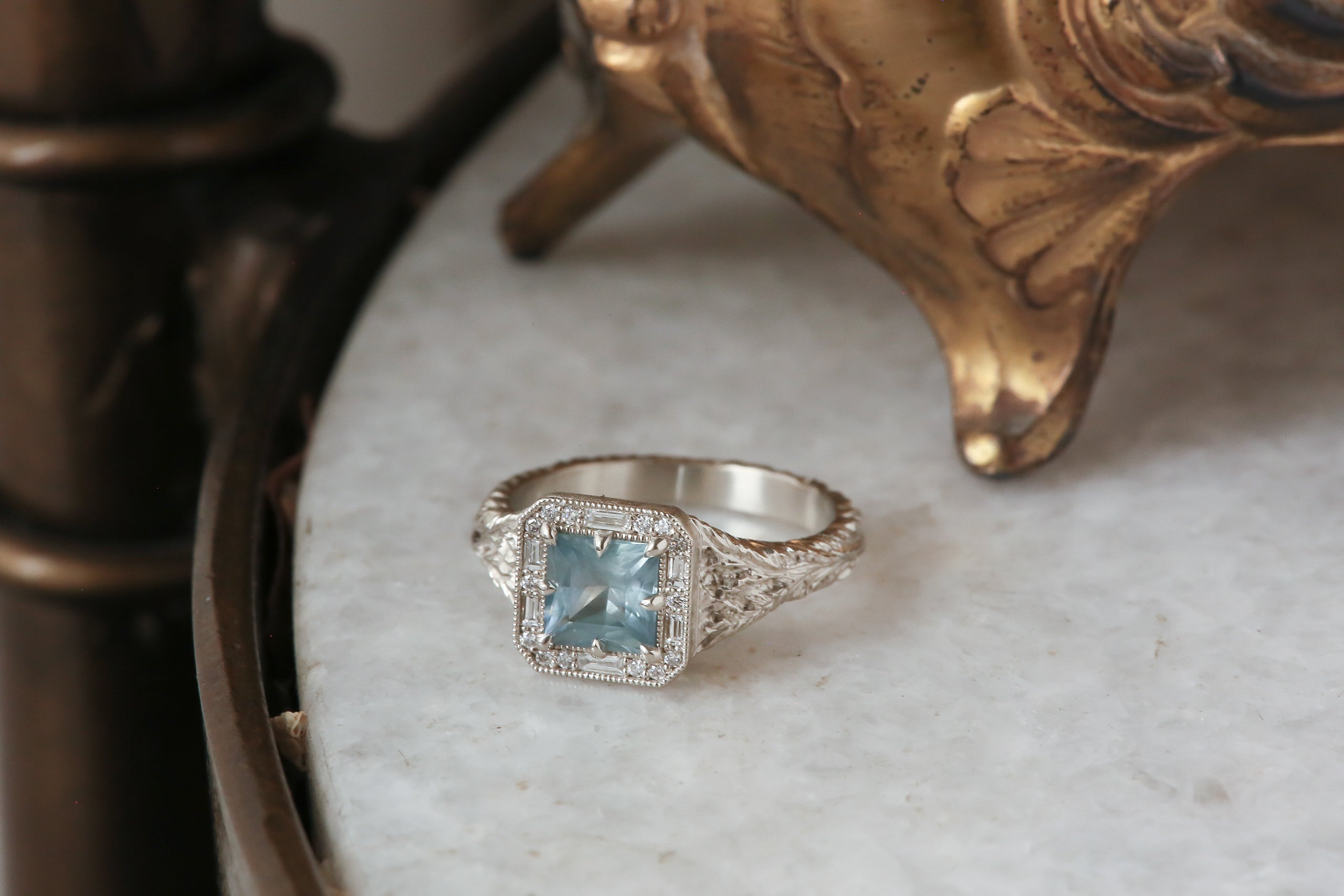 The Spire Signet Ring in Natural Blue Princess Cut Montana Sapphire and Diamond Halo