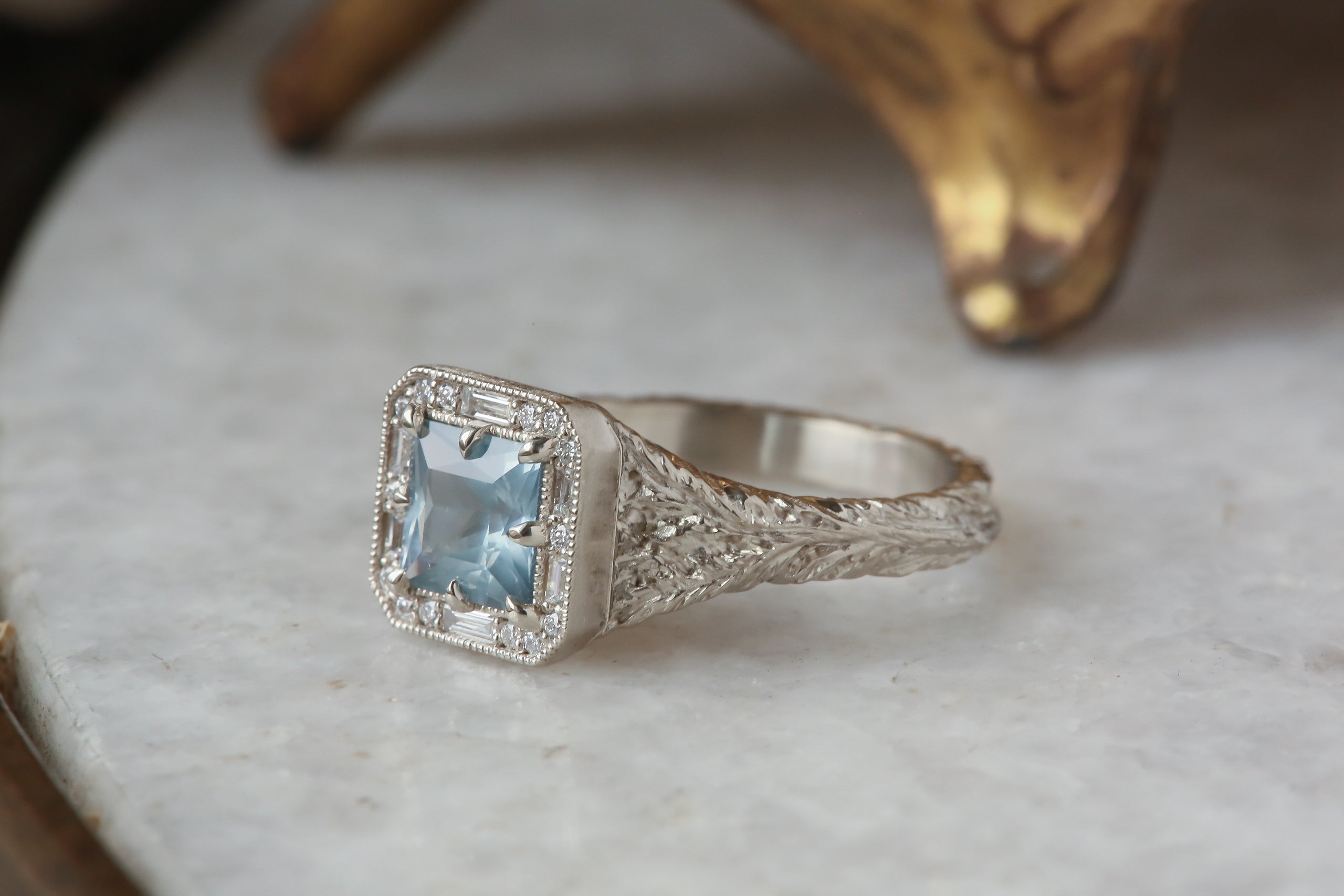 The Spire Signet Ring in Natural Blue Princess Cut Montana Sapphire and Diamond Halo