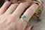 The Spire Signet Ring in Natural Blue Princess Cut Montana Sapphire and Diamond Halo