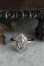 The Hidden Gate Solitaire Heirloom Setting shown with a rose cut natural salt and pepper diamond in reclaimed white gold. 