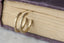 Everyday solid 10 karat yellow gold hoop earrings with hand-carved leaves and brushed finish. 