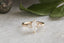A three stone engagement ring in marquise diamond and yellow gold