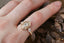 Ready to ship fantasy three stone engagement ring in oval brilliant cut lab grown diamonds and reclaimed 14 karat yellow gold by The North Way Studio. Size 6 1/2. Shown on the hand. 
