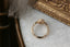 Ready to ship fantasy three stone engagement ring in oval brilliant cut lab grown diamonds and engraved, reclaimed 14 karat yellow gold by The North Way Studio. Size 6 1/2. 