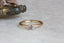 A solitaire ring inspired by antique collet settings in 14 karat yellow gold and natural Montana sapphire