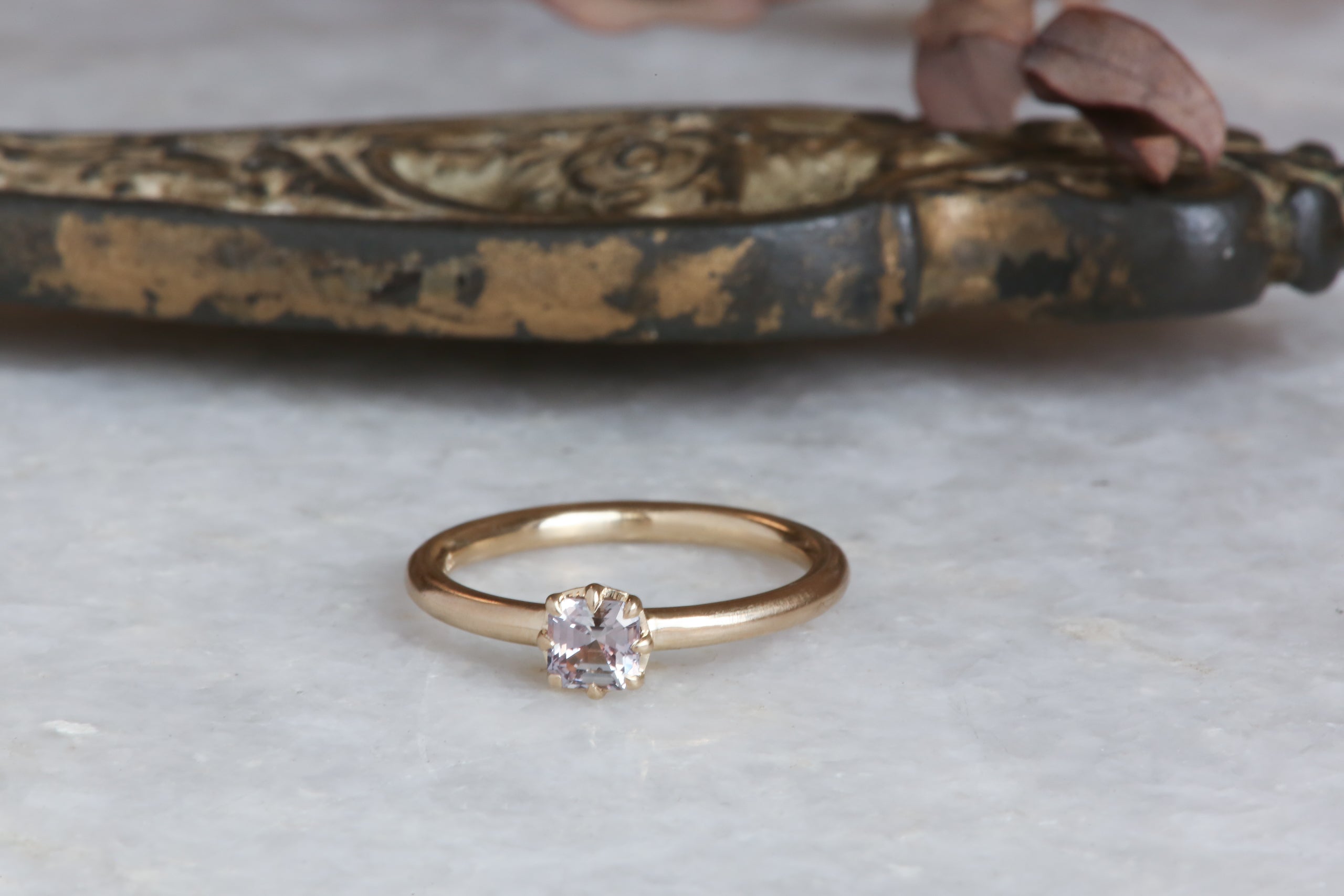 A solitaire ring inspired by antique collet settings in 14 karat yellow gold and natural Montana sapphire