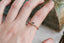 A solitaire ring inspired by antique collet settings in 14 karat yellow gold and natural Montana sapphire