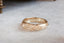 A hand-carved floral signet ring inspired by medieval jewelry and Joan of Arc. Shown in 14 karat yellow gold.