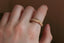 A hand-carved floral signet ring inspired by medieval jewelry and Joan of Arc. 