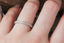 Straight diamond and miligrain half eternity band. 
