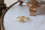 An antique inspired wide flower signet band. Hand-carved lavender flower for protection. Ready to ship in 10 karat yellow gold with a soft brushed finish.